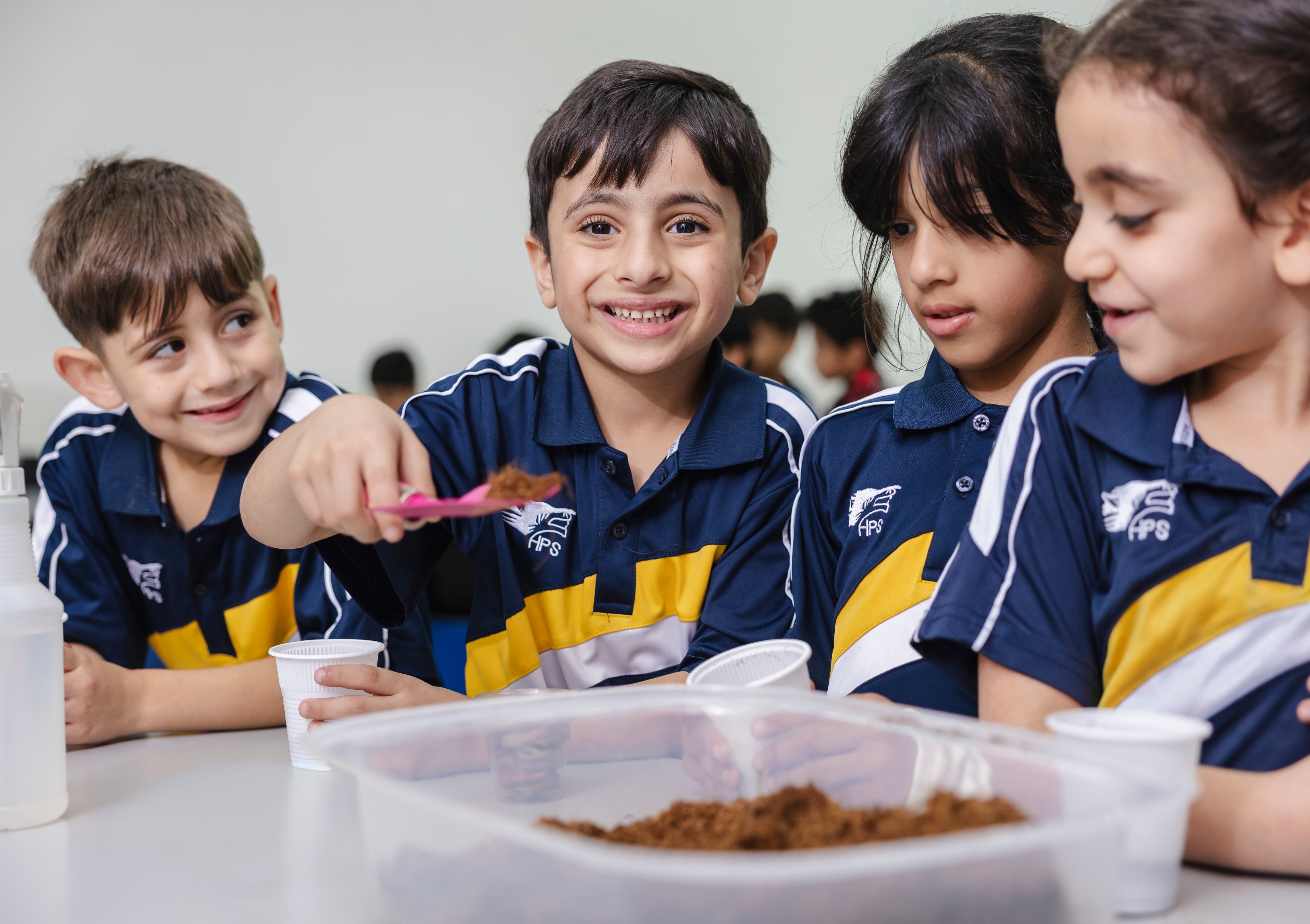 Students engaged in a hands-on science activity at a lab table